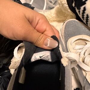 Light Gray Nike Sneakers with Breathable Fabric and White Rubber Sole